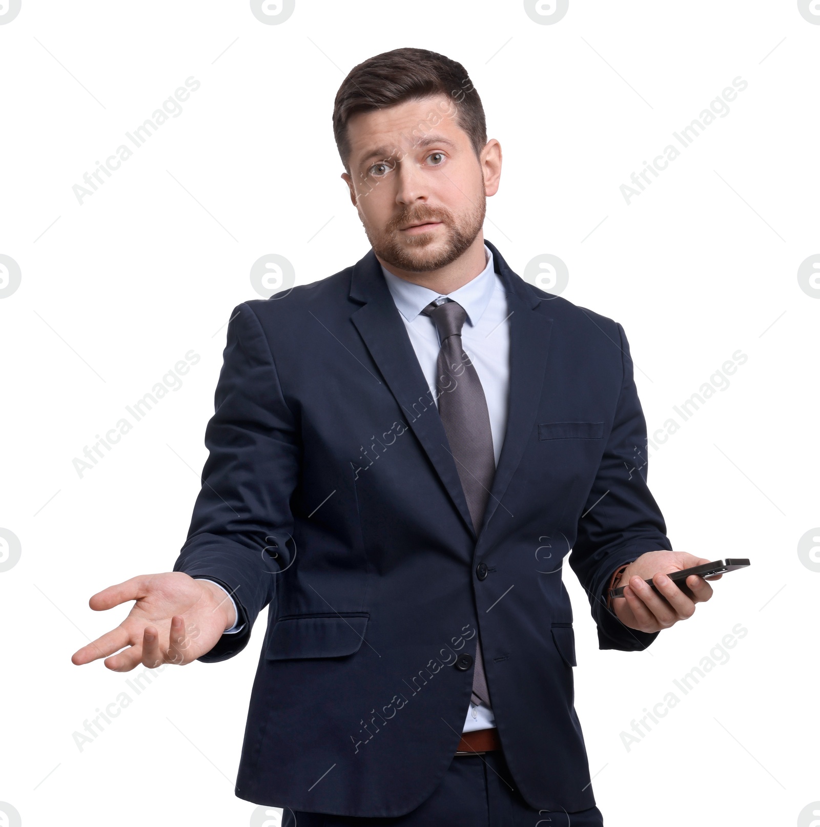 Photo of Handsome bearded businessman in suit using smartphone on white background