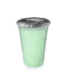 Yummy cotton candy in plastic cup on white background