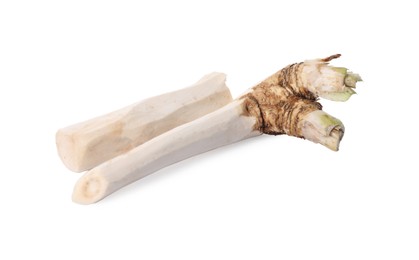 Photo of Fresh peeled horseradish roots isolated on white