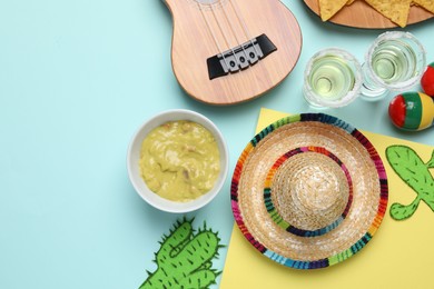 Flat lay composition with Mexican sombrero hat on color background