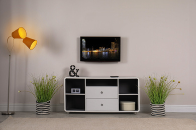 Image of Living room interior with TV on light wall