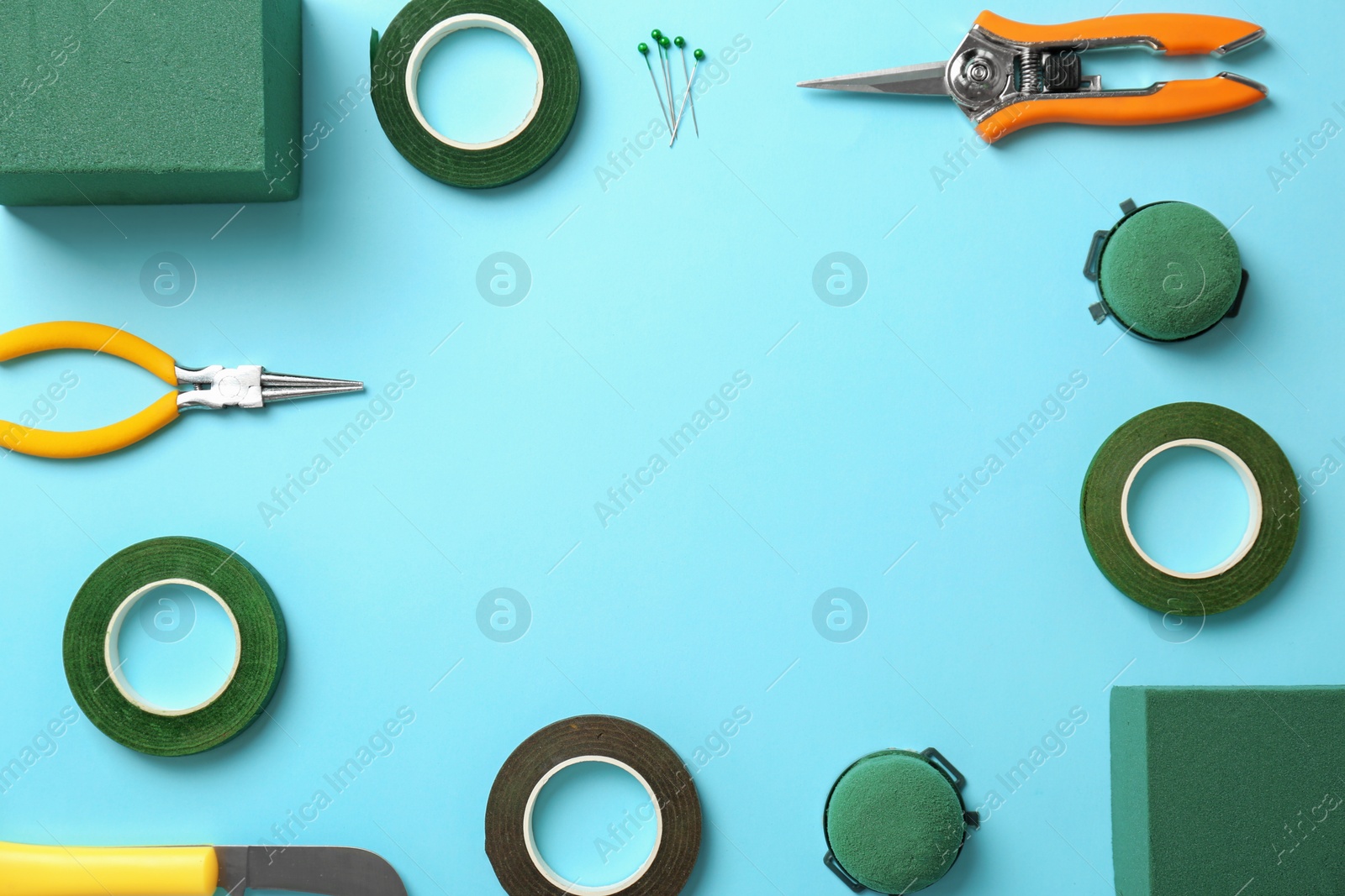 Photo of Florist equipment on color background, top view