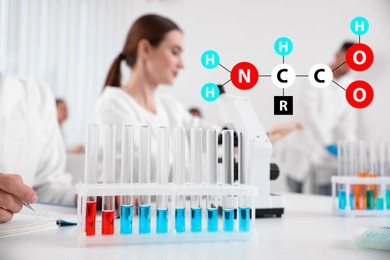 Image of Amino Acids chemical formula, illustration. Rack with test tubes on white table and scientists in laboratory 