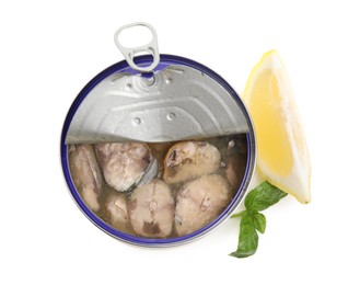 Photo of Open tin can with mackerel chunks , lemon and basil on white background, top view