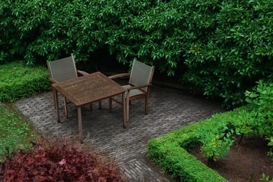 Cozy yard with patio furniture and green shrubbery
