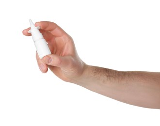 Man holding nasal spray on white background, closeup