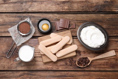 Flat lay composition with ingredients for tiramisu on wooden table