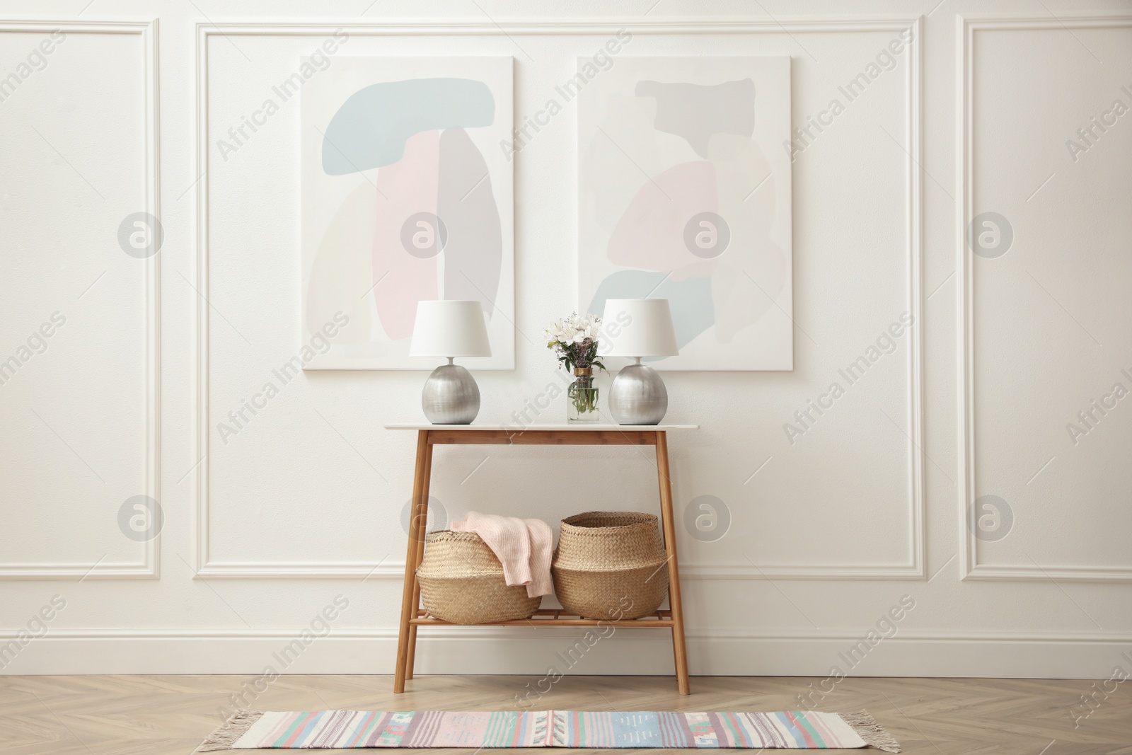 Photo of Elegant room interior with console table and beautiful flowers bouquet