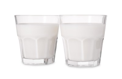 Photo of Glasses of fresh milk isolated on white