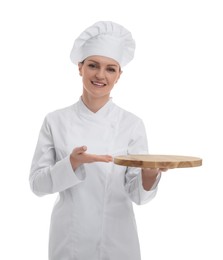 Photo of Happy chef in uniform holding empty wooden board on white background