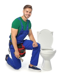 Photo of Young man working with toilet bowl, isolated on white