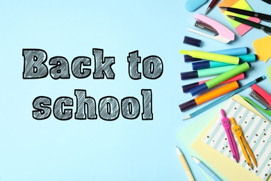 Text Back To School and different stationery on light blue background, flat lay