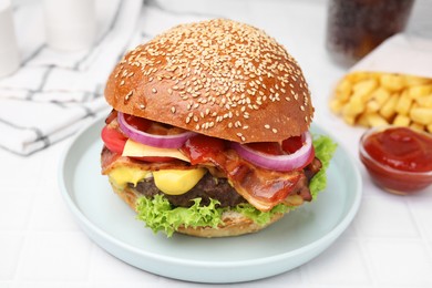 Photo of Delicious burger with bacon, patty and vegetables on white tiled table, closeup
