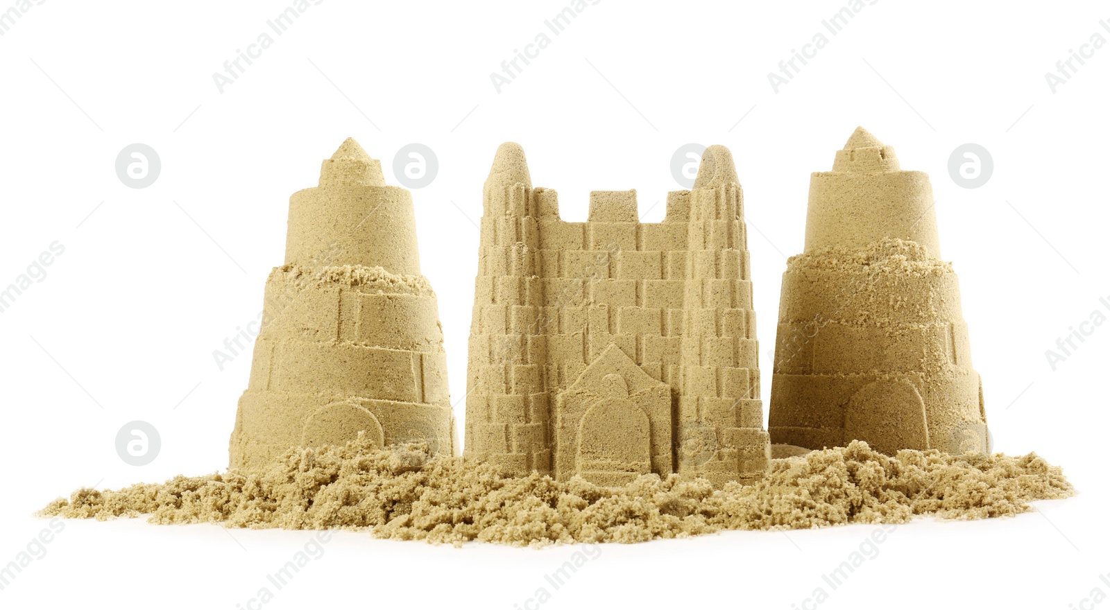 Photo of Pile of sand with beautiful castles isolated on white