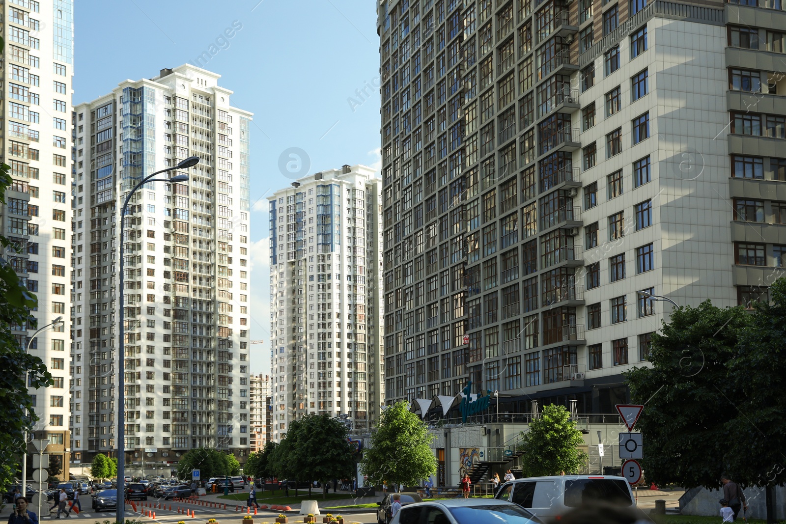 Photo of KYIV, UKRAINE - MAY 21, 2019: Beautiful view of modern housing estate in Pecherskyi district on sunny day