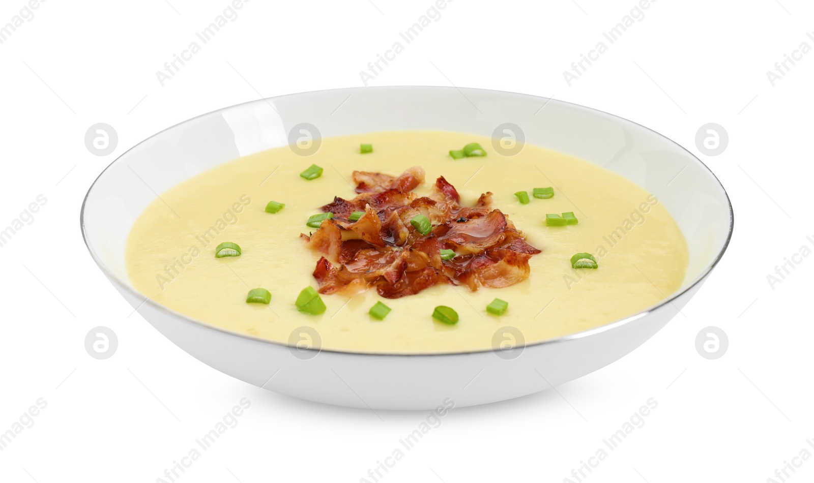 Photo of Tasty potato soup with bacon and green onion in bowl isolated on white