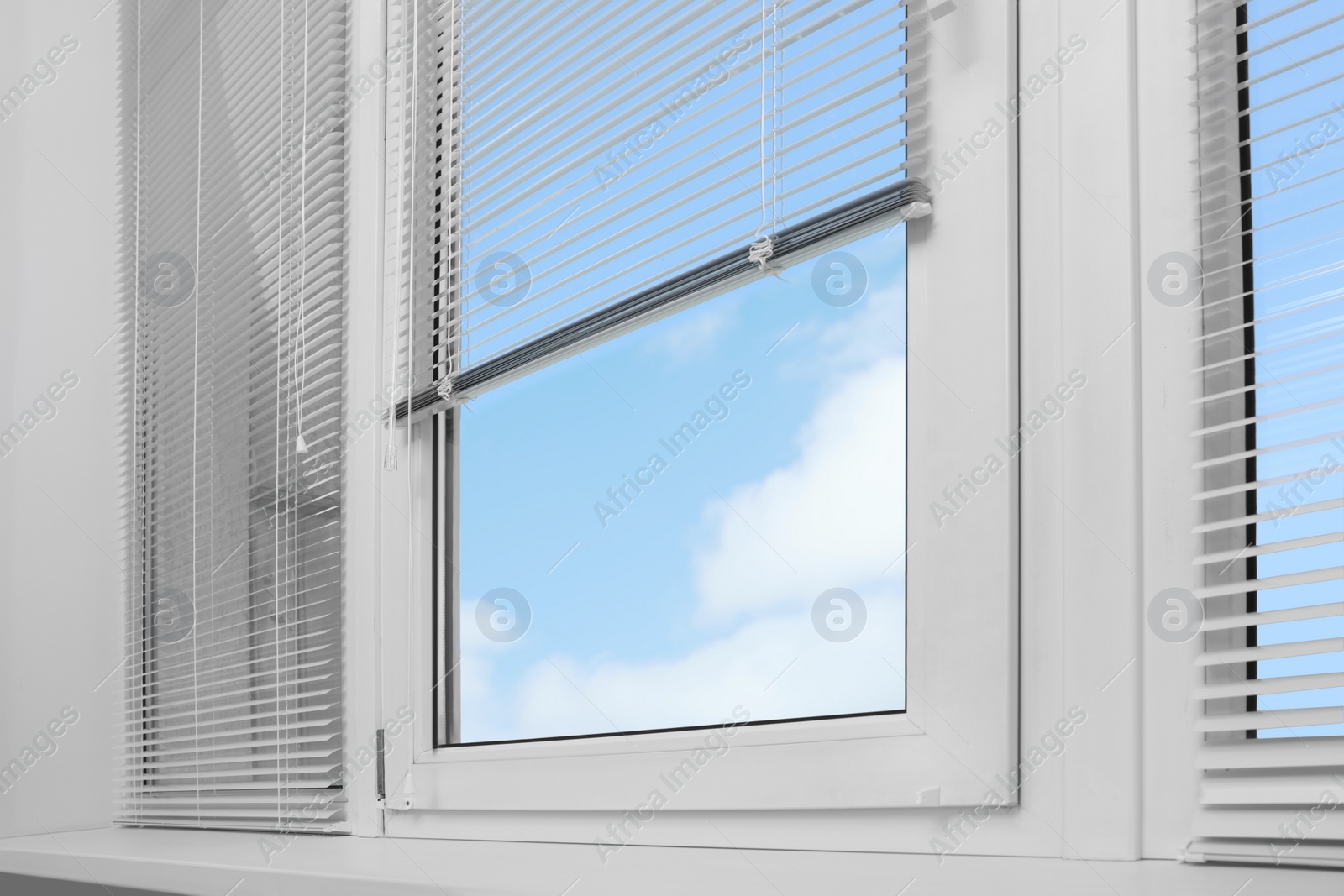 Photo of Window with horizontal blinds indoors, low angle view