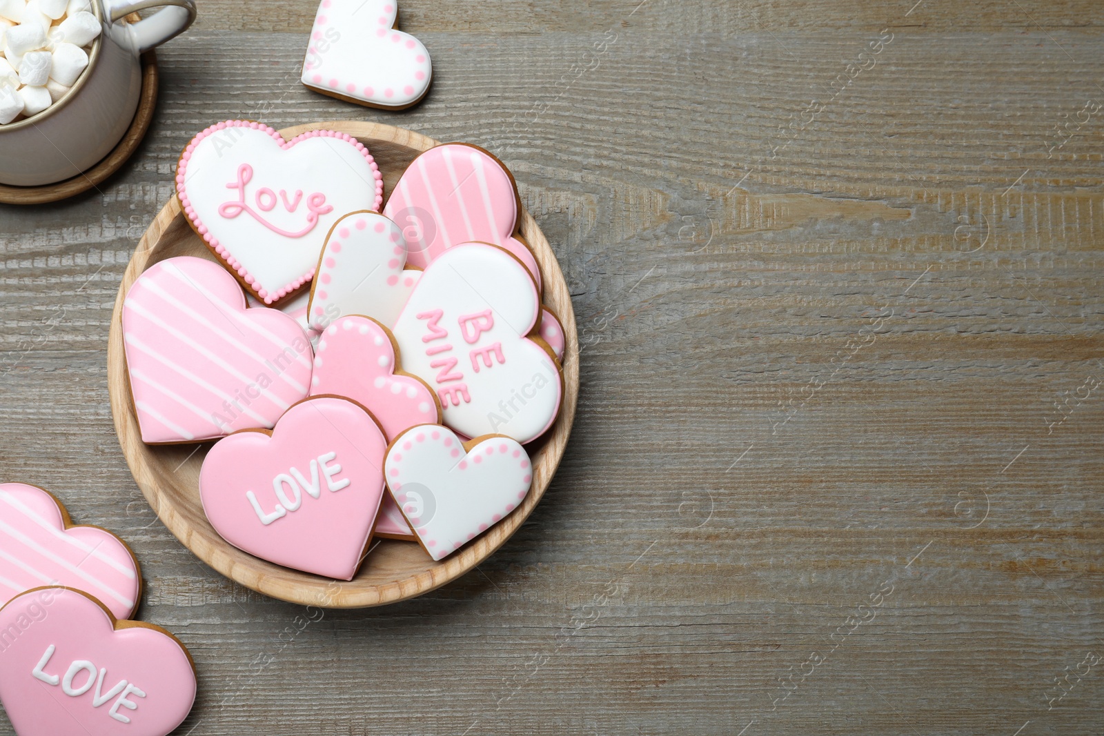 Photo of Valentine's day cookies on wooden table, flat lay. Space for text