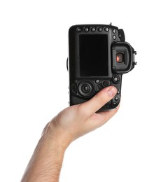 Photographer holding modern camera on white background, closeup