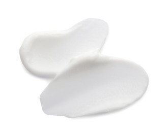 Photo of Samples of face cream on white background