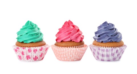 Different delicious colorful cupcakes on white background