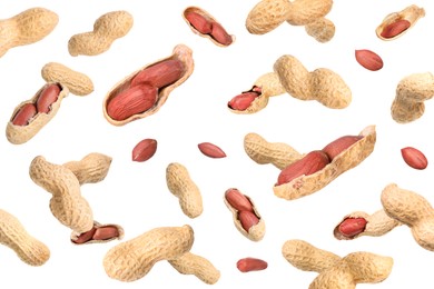 Image of Unpeeled peanuts in air on white background