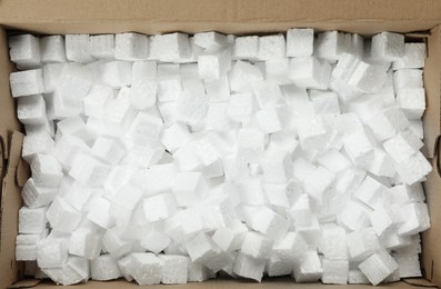 Photo of Closeup view of cardboard box with styrofoam cubes