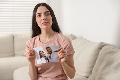 Woman ripping photo at home. Divorce concept