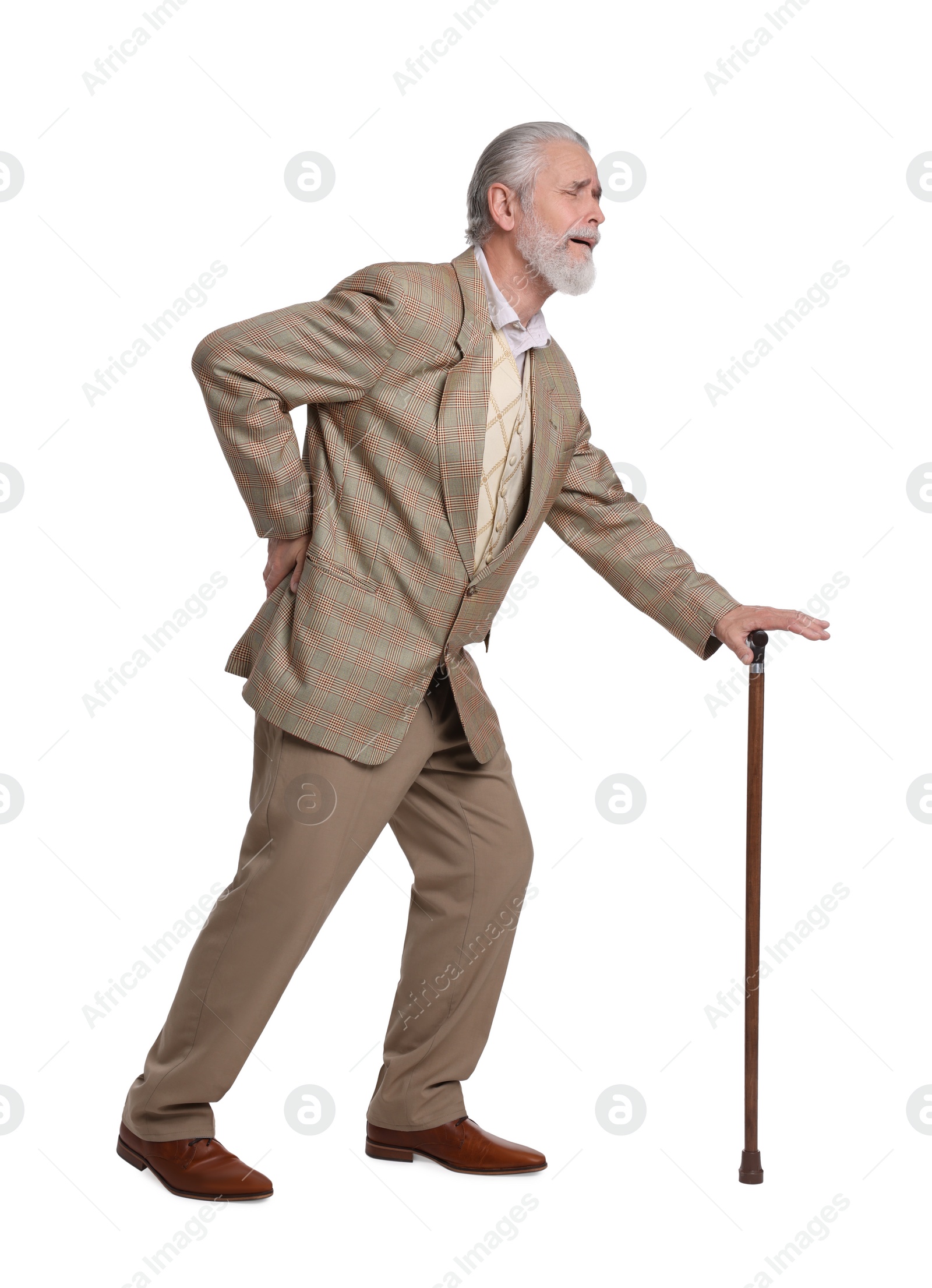 Photo of Senior man with walking cane suffering from back pain on white background