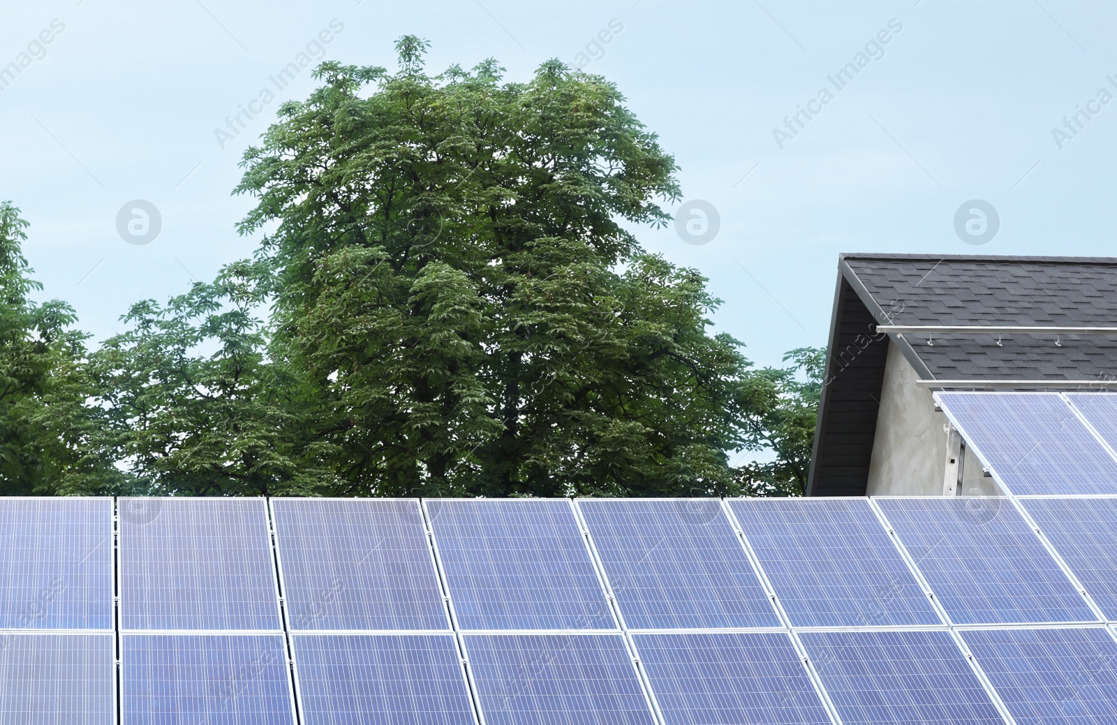 Photo of Building with installed solar panels on roof. Alternative energy source