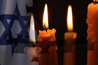 Image of Holocaust memory day. Flag of Israel, burning candles and barbed wire, multiple exposure
