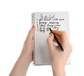 Woman checking to do list on white background, closeup