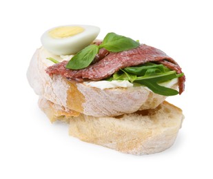 Photo of Delicious bruschettas with anchovies, cream cheese, eggs and greens isolated on white