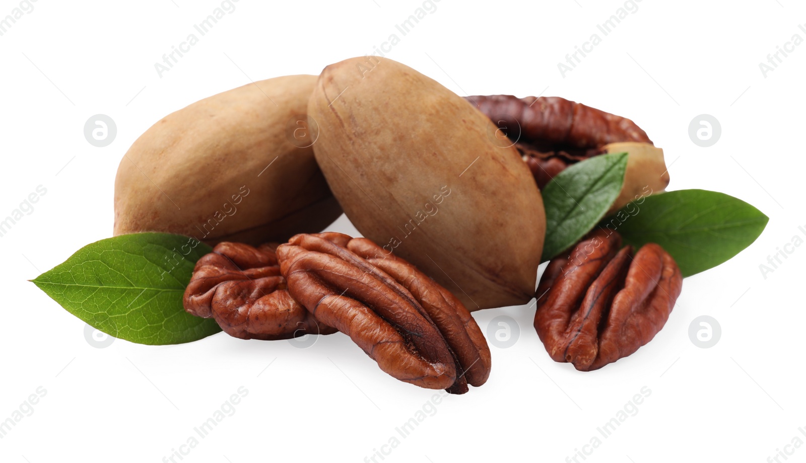 Photo of Many tasty pecan nuts with green leaves isolated on white