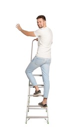 Photo of Young man climbing up metal ladder on white background