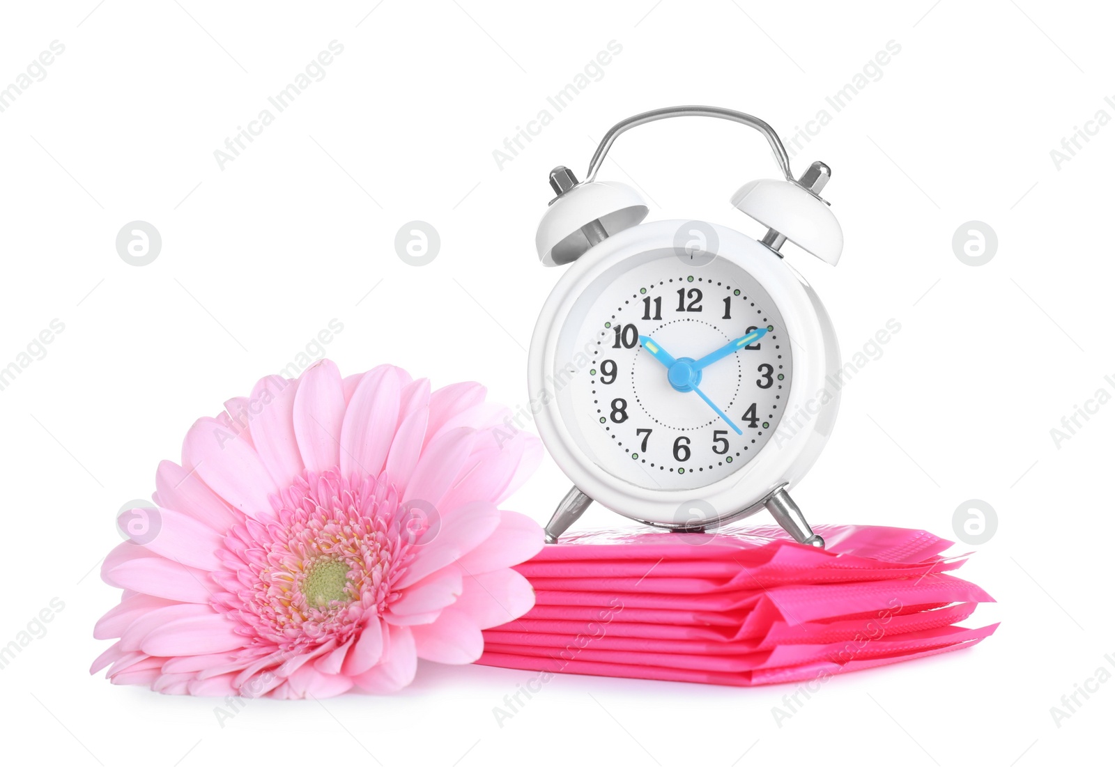 Photo of Clock, menstrual pads and flower on white background. Gynecology concept