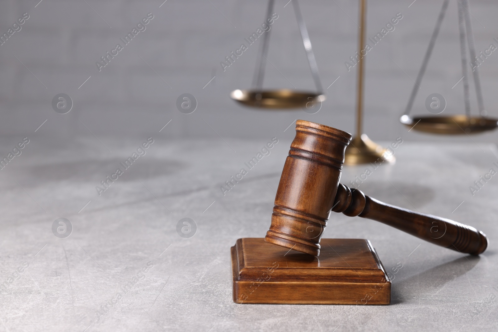 Photo of Law concept. Judge's gavel on light grey table, space for text