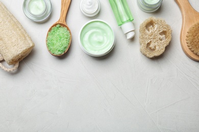 Photo of Flat lay composition with body care products and space for text on light background