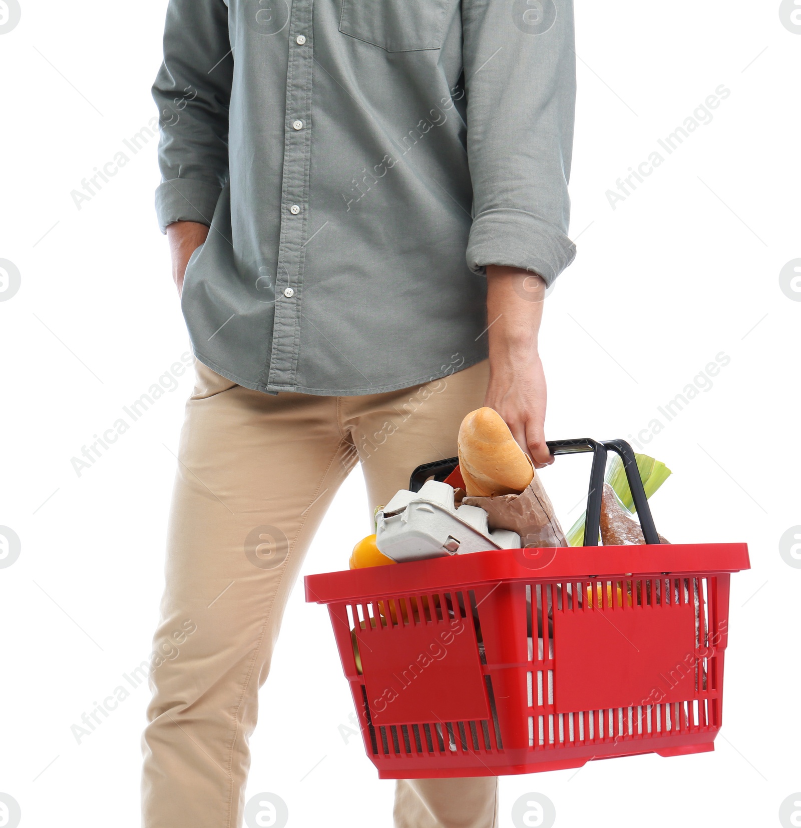 Photo of Man with shopping basket full of products isolated on white, closeup