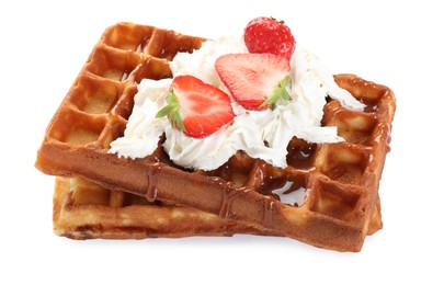 Photo of Delicious Belgian waffles with strawberries, whipped cream and caramel sauce on white background