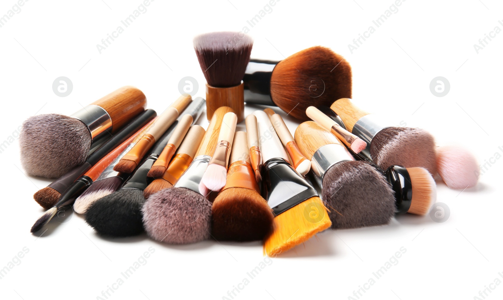 Photo of Makeup brushes of professional artist on white background