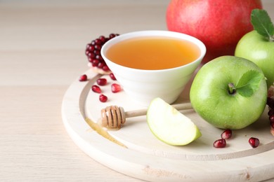 Photo of Honey, pomegranate and apples on wooden table. Rosh Hashana holiday