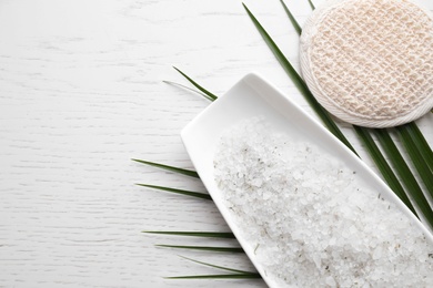 Photo of Flat lay composition with sea salt on white wooden background, space for text. Spa treatment