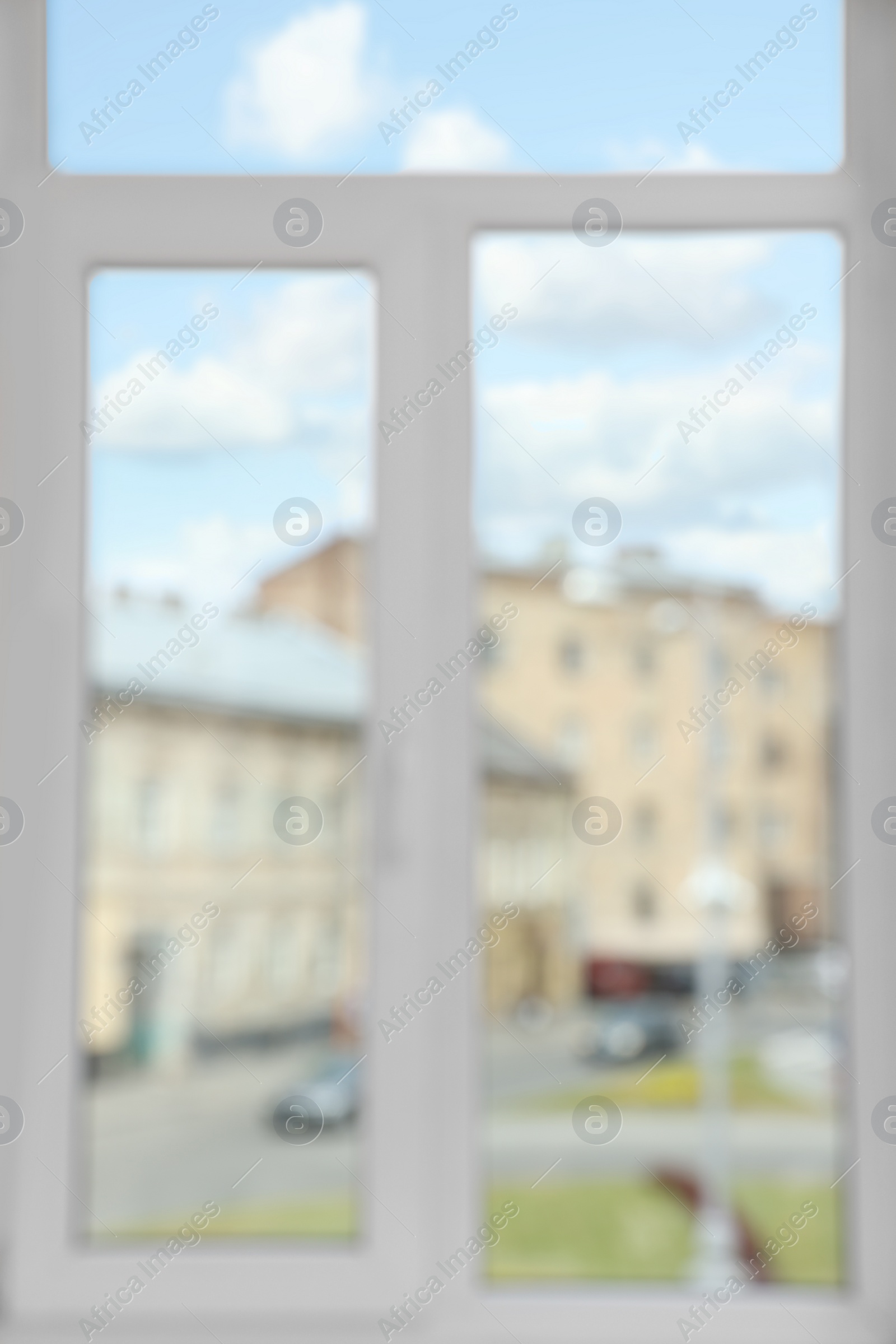 Photo of Blurred view of window with white frame indoors