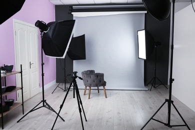 Photo of Interior of modern photo studio with professional equipment