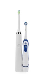 Photo of Electric toothbrushes on white background. Dental care