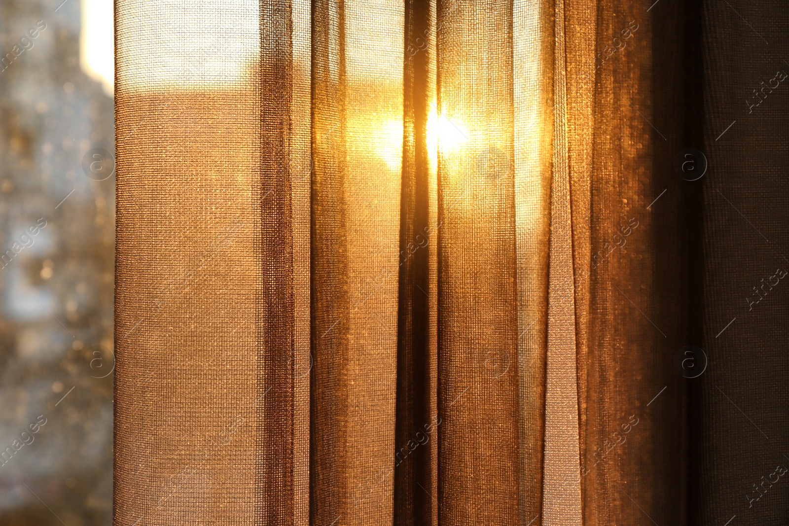 Photo of Window with beautiful transparent curtain, closeup view