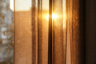 Window with beautiful transparent curtain, closeup view