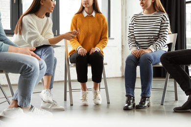 Psychotherapist working with patients in group therapy session, closeup