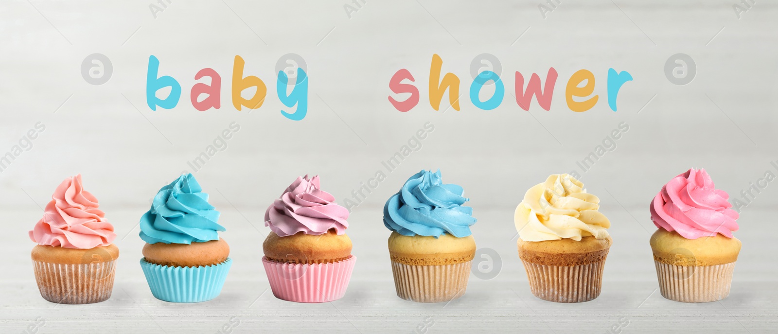 Image of Delicious cupcakes for baby shower party on light table, banner design